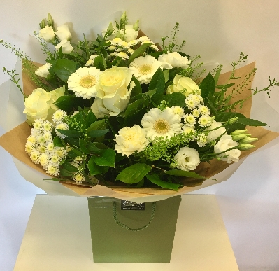 Mixed hand tied natural in style including greenbell, roses and germini. 