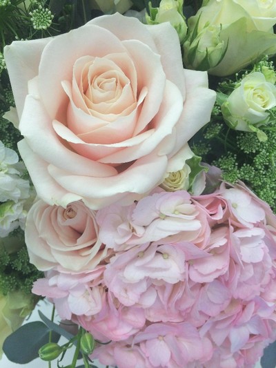 Luxury bouquet of pale pink hydrangea and roses, white rose and lisianthus and finished with eucalyptus and large glass vase. 