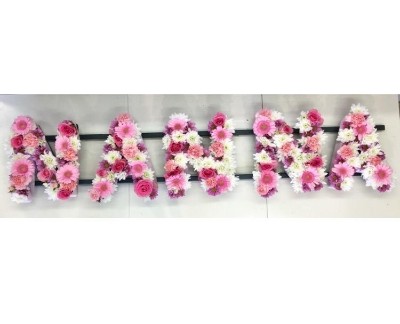 Mixed NANNA funeral lettering in pale pink and white tones. 