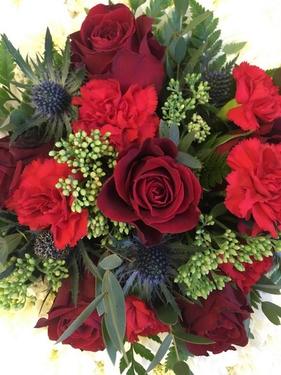 British themed tea pot funeral tribute created with chrysanthemum, roses and hydrangea detailing. 