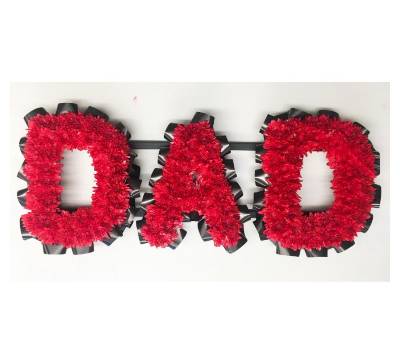 DAD lettering with sprayed chrysanthemums, finished with a contrasting ribbon edge. 