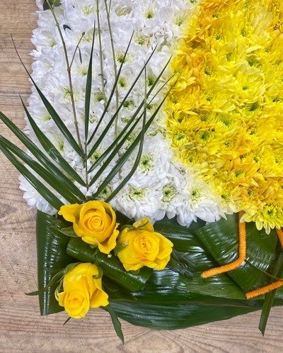 Stunning duck funeral tribute made with fresh chrysanthemum and spray paint detailing bringing the design together. 