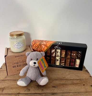 Gift bundle including - 1 x Cosy Teddy Bear  1 x Chocolate Truffle Gift Tin  1 x Luxury Candle