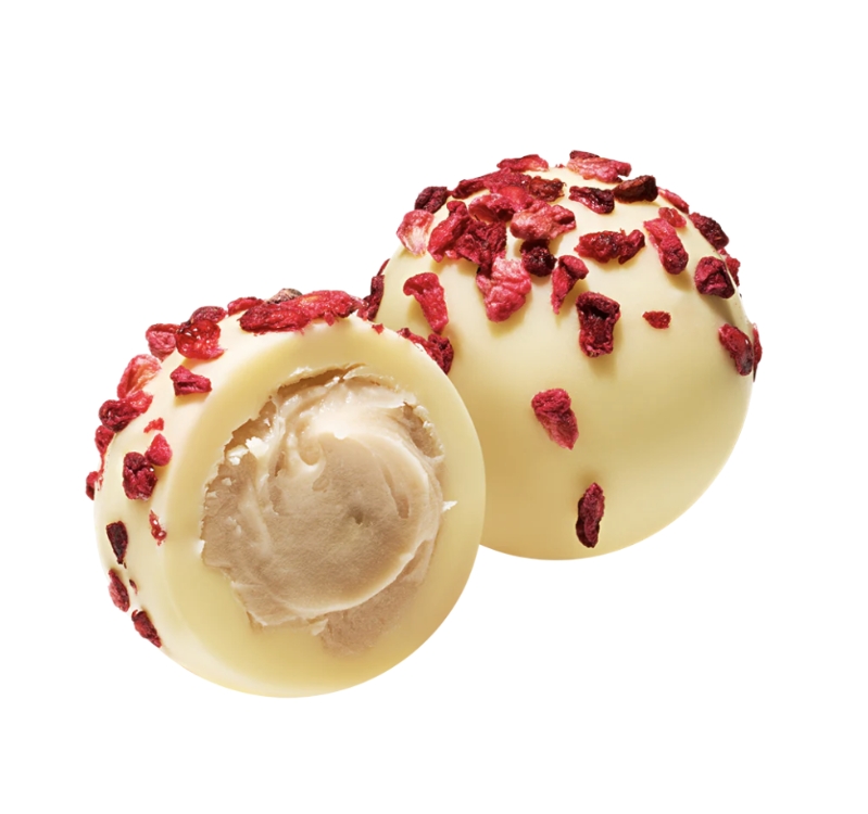 A tray of six decadent white chocolate truffles filled with a raspberry & champagne cream. 