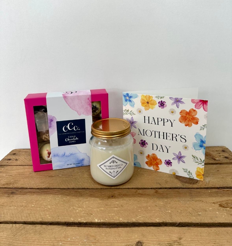 Mum’s The Word' Gift Bundle includes 1 x Luxury candle, 1 x 9 Piece chocolate Gift Box and a bespoke mother's day card.