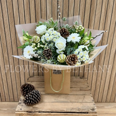 Luxury all-white Christmas bouquet with natural alpine textures and winter greenery.