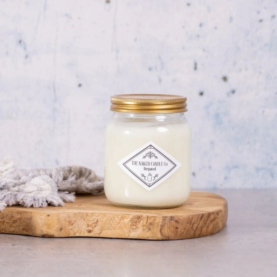 The Naked Candle Co Bergamot soy candle with fresh citrus and floral fragrance notes.
