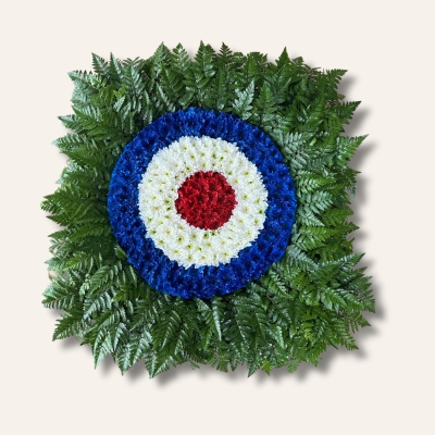 MOD target funeral tribute featuring concentric rings of red, white and blue chrysanthemum with a foliage border on a 2ft x 2ft base.