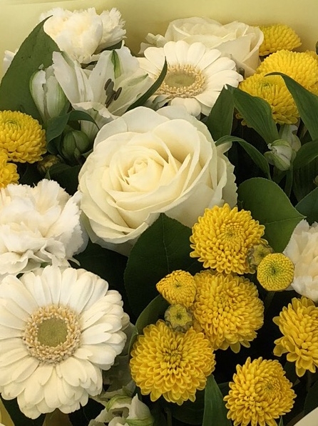 Mixed hand tied of roses, germini and chrysanthemum in yellows and whites. 