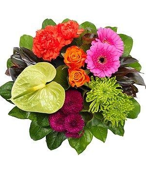 Mixed vibrant posy funeral tribute including roses, germini and carnation. 
