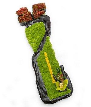 Golf bag funeral tribute made with green massed chrysanthemum and green orchid focal. 