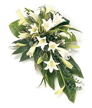 White lily single ended funeral spray with complementary foliage.