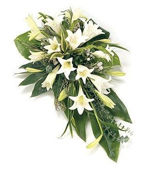 Single-ended funeral spray with white longiflorum lilies and complementary foliage.