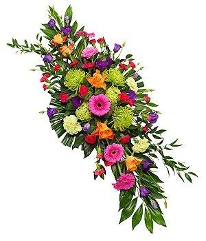 Vibrant double-ended spray with orange, pink, purple, and green seasonal florals and foliage.