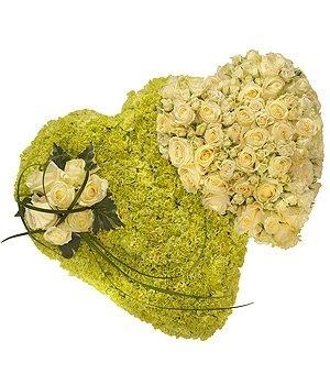 Luxury double heart funeral tribute in luxury white roses and green carnation. 