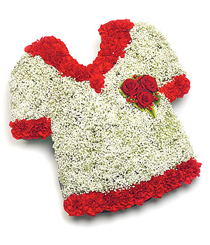Classic football shirt funeral tribute made with white gypsophila and red carnations. 