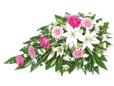 Single-ended spray with soft pink and white seasonal flowers.