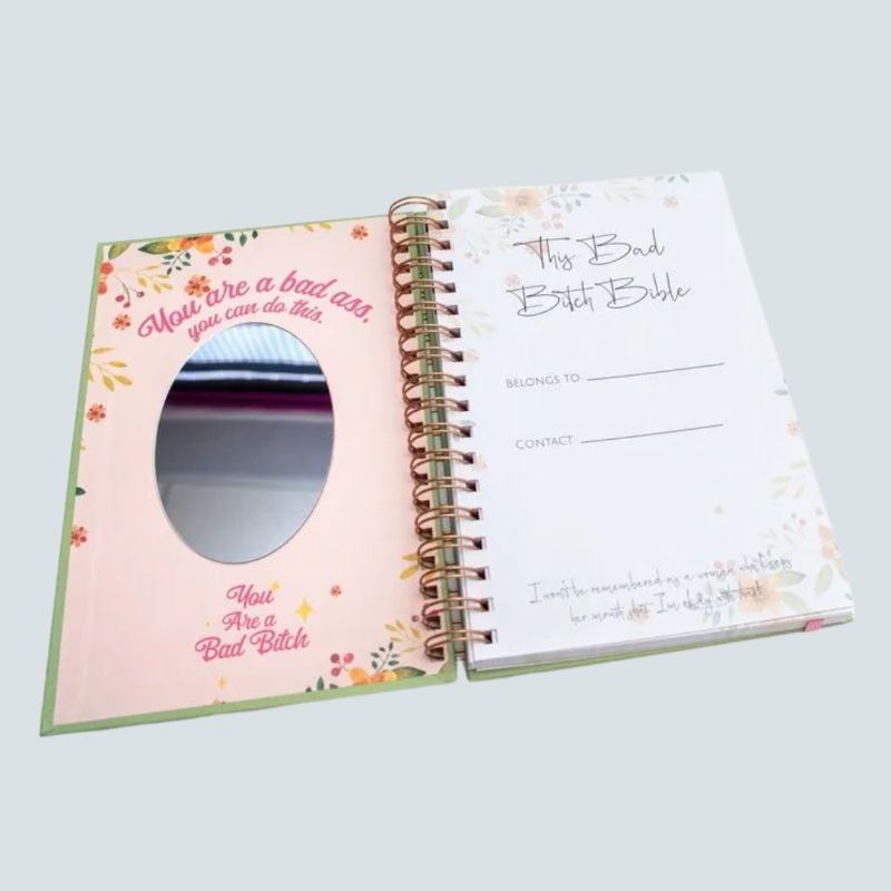 Bad Bitch Bible daily planner with rose gold foil cover, spiral binding, stickers and mirror – fun stationery gift available from Flowers by Bethany Manchester.