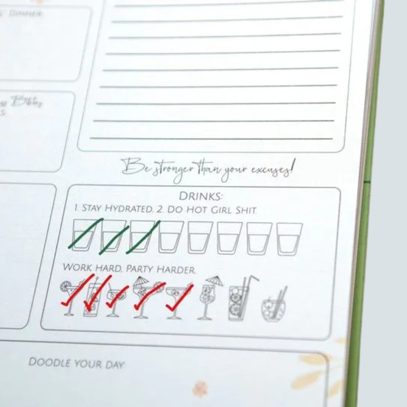 Bad Bitch Bible daily planner with rose gold foil cover, spiral binding, stickers and mirror – fun stationery gift available from Flowers by Bethany Manchester.