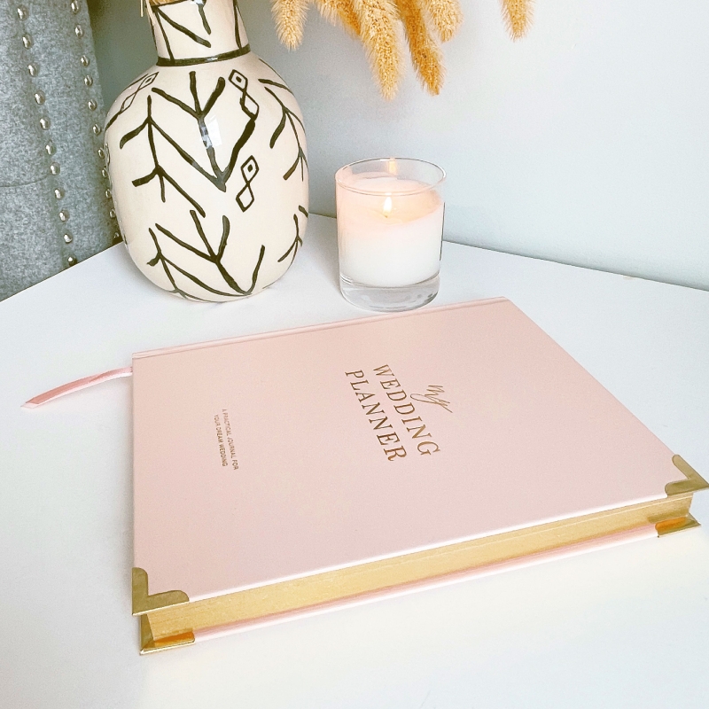 Blush & Gold Blush wedding planner with soft blush pink cover and gold detailing.