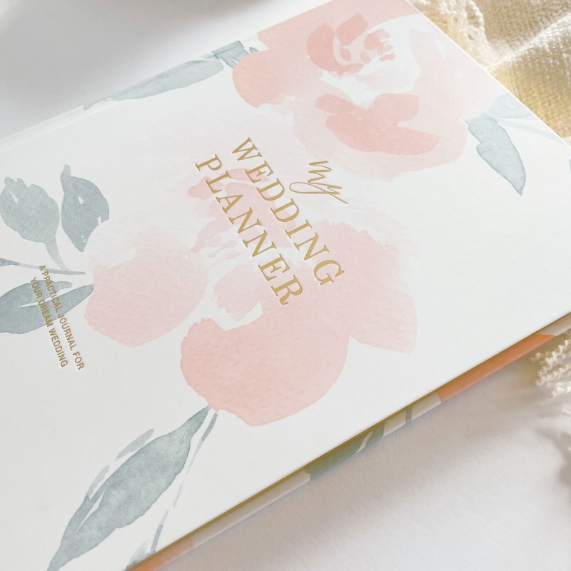 Blush & Gold Floral wedding planner with pastel floral cover and gold detailing.