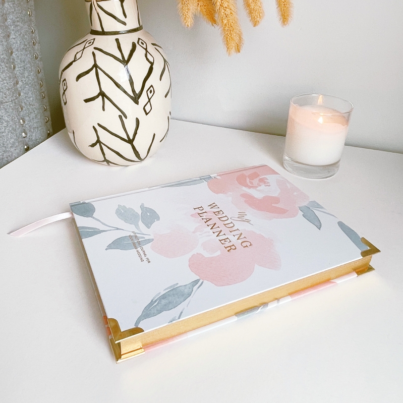 Blush & Gold Floral wedding planner with pastel floral cover and gold detailing.