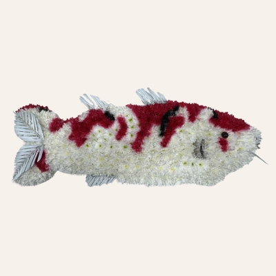 Koi fish funeral tribute with white chrysanthemum base, red and black sprayed detailing, palm leaf fins, gill detailing, and whisker accents.