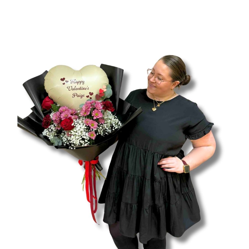 Large Valentine’s bouquet with red roses, pink flowers, gypsophila and eucalyptus in black wrap with red ribbon, created out of water to place into your own vase, featuring a personalised heart-shaped balloon arranged within the bouquet.