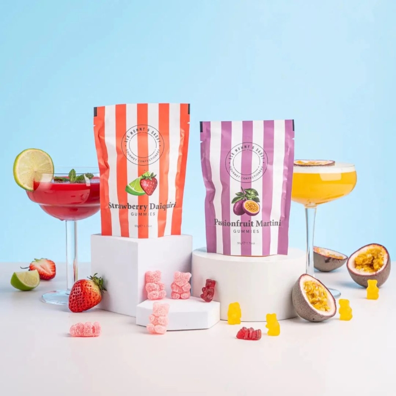 Ask Mummy & Daddy Passionfruit Martini cocktail gummies, palm-oil-free, gluten-free and dairy-free, in a purpe and white stripe gift pouch.