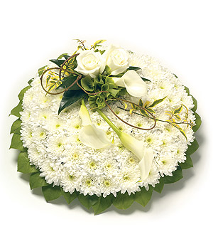 White and green massed funeral posy.