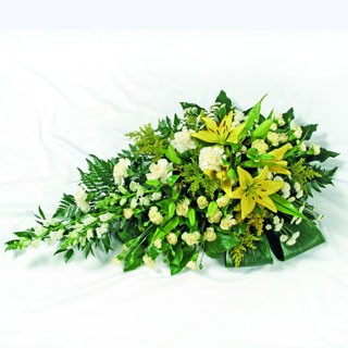 Single-ended spray with yellow and gold seasonal flowers.