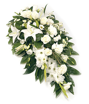 Single ended spray in pure whites and mixed foliage. 