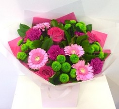 Lovely mix of mint green and raspberry pink colours including roses, germini and chrysanthemum. 