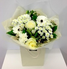 All white bouquet perfect for our winter season including roses, germini and chrysanthemum. 