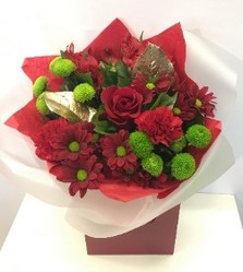 Red bouquet including roses, chrysanthemum and carnation finished with shining gold leaves. 