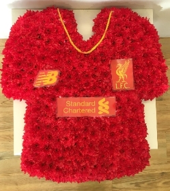Liverpool FC Shirt funeral tribute created with massed chrysanthemum and printed logos and badges. 