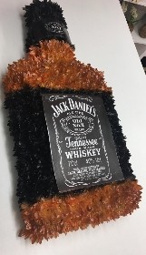 Jack Daniels funeral tribute created with chrysanthemum and waterproof badge and logo. 