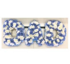 Checked DAD funeral tribute with mixed blue and white flowers and matching blue ribbon edge. 