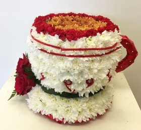 3D cup of tea funeral tribute made with chrysanthemum and spray carnation. 