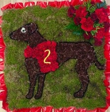 Racing dog funeral tribute with moss background and pipe cleaner detailing. 