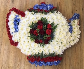 British themed tea pot funeral tribute created with chrysanthemum, roses and hydrangea detailing. 