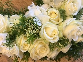 Heart of Manchester funeral tribute made of pure white roses and hydrangea. 