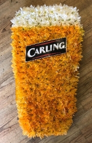 Carling pint funeral tribute made using sprayed chrysanthemum and a carling logo. 
