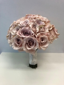 Luxury domed bridal bouquet including large headed quicksand roses. 