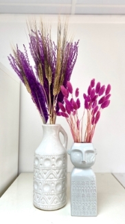 Duo vase set with bold pink and purple dried flowers. 