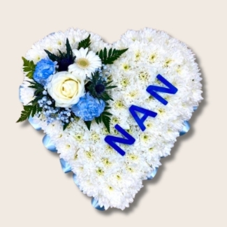 Heart-shaped funeral tribute with laminated wording, white chrysanthemums, delicate ribbon edge, and matching focal. Customizable colour options available.