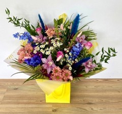 Stunning mixed vibrant bouquet including blue pampas, daisy's and pink roses bringing that zing into your loved ones life. 