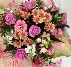 This bouquet is extra in itself, glitter, butterfly's and ribbons make the roses, germini and anthuriums in this design pop. 