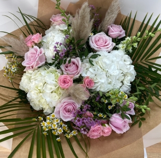 Boho barbie bouquet filled with pink and white florals and finished with pampas grass all hand tied in water. 