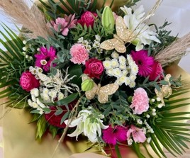 Beautiful bouquet filled with crisp white and rose-pink tones including roses, germini and hypericum berries all brought together with gold painted branches and fluffy pampas grass. 